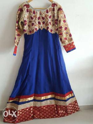 Red and blue floor length dress with dupatta.