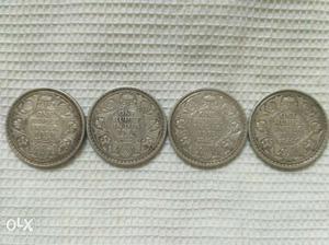 Set of four old King George V rupee one coins, saleable as