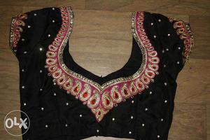 Surya fashion designer. black and rose embroidery