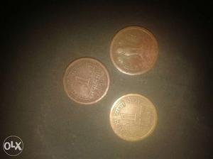 Three Round Bronze And Gold Coins