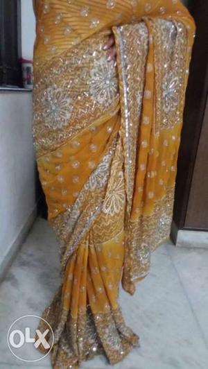 Women's yellowAnd silver work beautiful sari with work