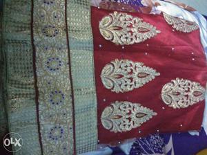 A brand new red lehanga/dhavani. Semistiched and
