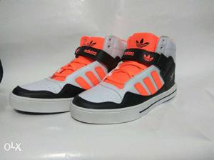 Pair Of Orange And Gray Adidas Sneakers