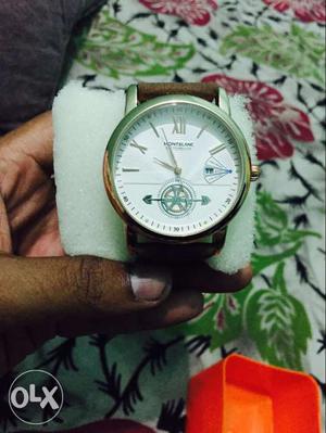 Round Silver Case Chronograph Watch With Brown Strap