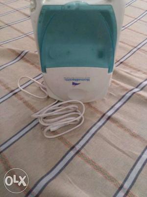 White And Teal Nebulizer