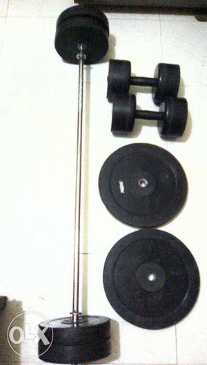 Black Barbell; Two Black Fixed Weight Dumbbells; Two Black