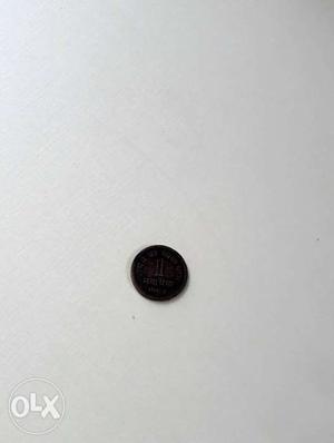 Round Black 1 paisa Coin