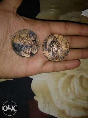 Two Round Copper Embossed Coins