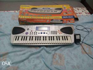 White And Grey Casio portable Electronic Keyboard M-150 With