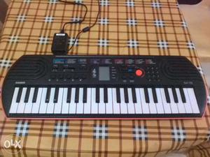 Casio SA-76 Keyboard, Casio AC adapter and Carry bag in like