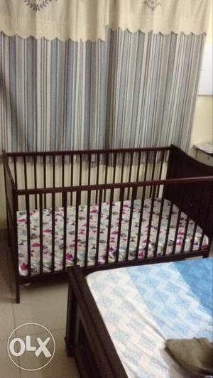 Baby crib in excellent condition. made of light