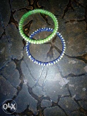 Blue green bangle with thread and plus