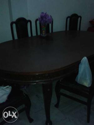Oval Brown Wooden Table With Four Chairs Dining Set