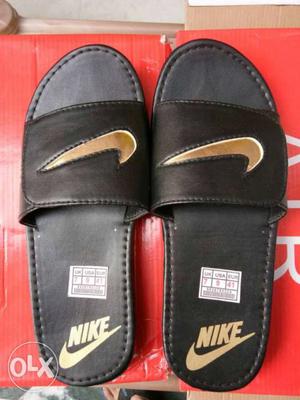 Pair Of Black-and-brown Nike Slide Sandals. No bargain