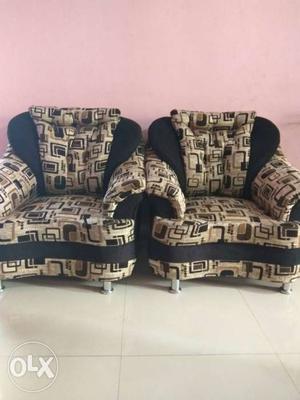 Two Beige-and-black Armchairs