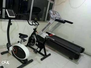 Two Black Stationary Bike And Treadmill