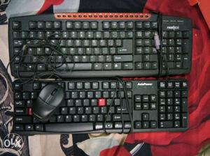 Two keyboard one mouse and web camera only just