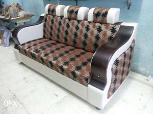 White And Brown Leather Padded Sofa