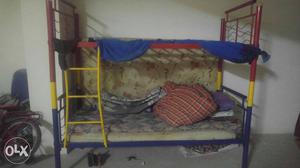 Yellow, Blue, And Red Metal Bunk Bed