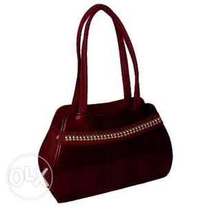 Brand new shoulder bag in maroon colour with