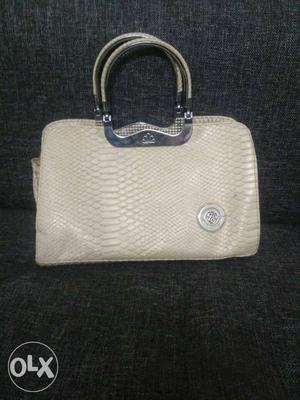 Branded handbag in excellent condition. Colour beige
