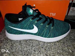 Green And White Nike Running Shoes