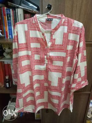 Light Beige Top and red print. For sizes Large to
