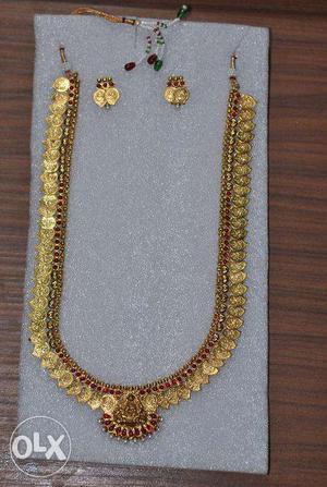 Long golden coloured coin necklace set