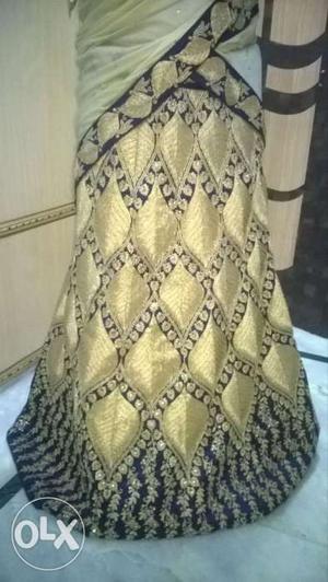 Navy blue color lehenga with golden embroidery