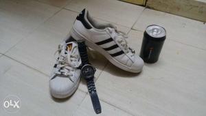 Pair Of Black And White Adidas Superstar