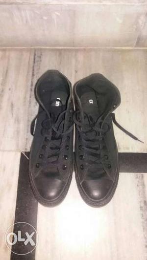 Pair Of Black Low Top Sneakers
