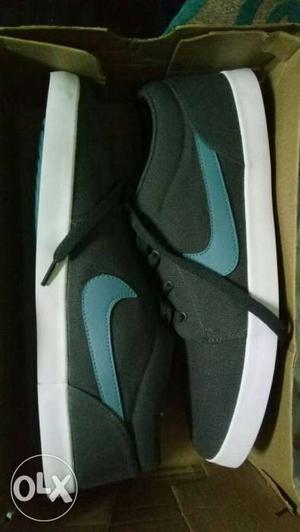 Pair Of Gray-white-and-teal Nike Sneakers In Box