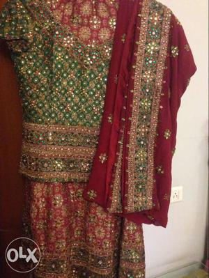 Red and green lengha in brand new condition, worn