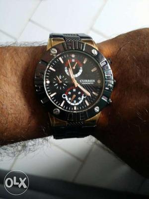 Round Black Curren Chronograph Watch With Black Rubber Strap