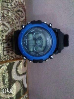 Round Blue Digital Watch With Black Strap