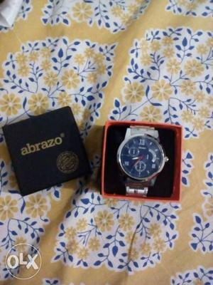 Round Silver Abrazo Chronograph Watch In Box