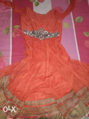 Rust colour anarkali suit with dupatta and lower.