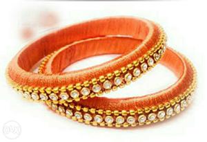 Two Orange Encrusted Bangle Bracelets