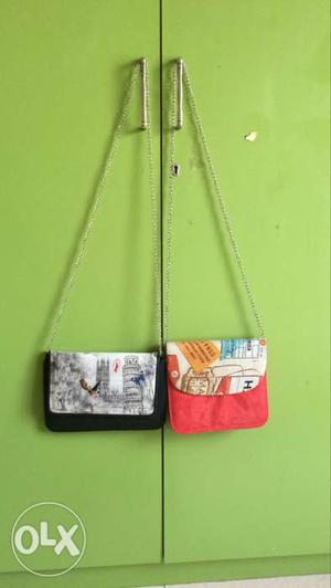 Two Red And Black Crossbody Bags