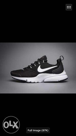 Unpaired Black And White Nike Low Top Shoe