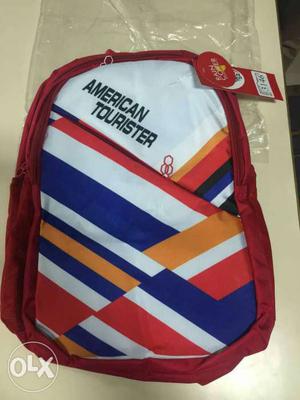 White, Red, Blue, And Orange American Tourister Backpack