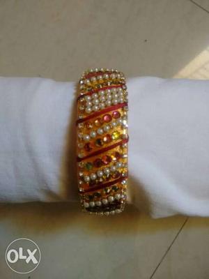 Woman's White, Red And Gold Beaded Bracelet