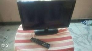 Black LG Flat Screen TV And Remote Controller