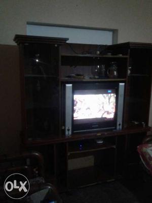 Gray CRT TV In Brown Wooden Tv Rack