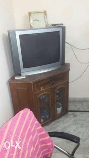Samsung 29 inches colored t.v and wooden trolley