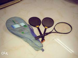 Three Black Tennis Racquets With Bag