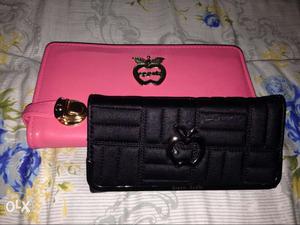 Two Black And Pink Wallets