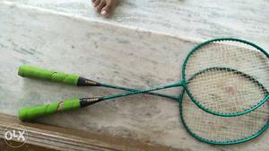 Two Green Badminton Rackets