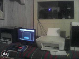 White Printer, Flat Screen Computer Monitor And Red Corded