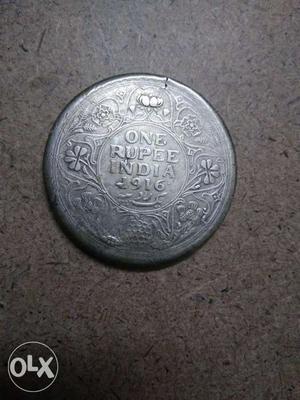 100 years old One rupee silver coin